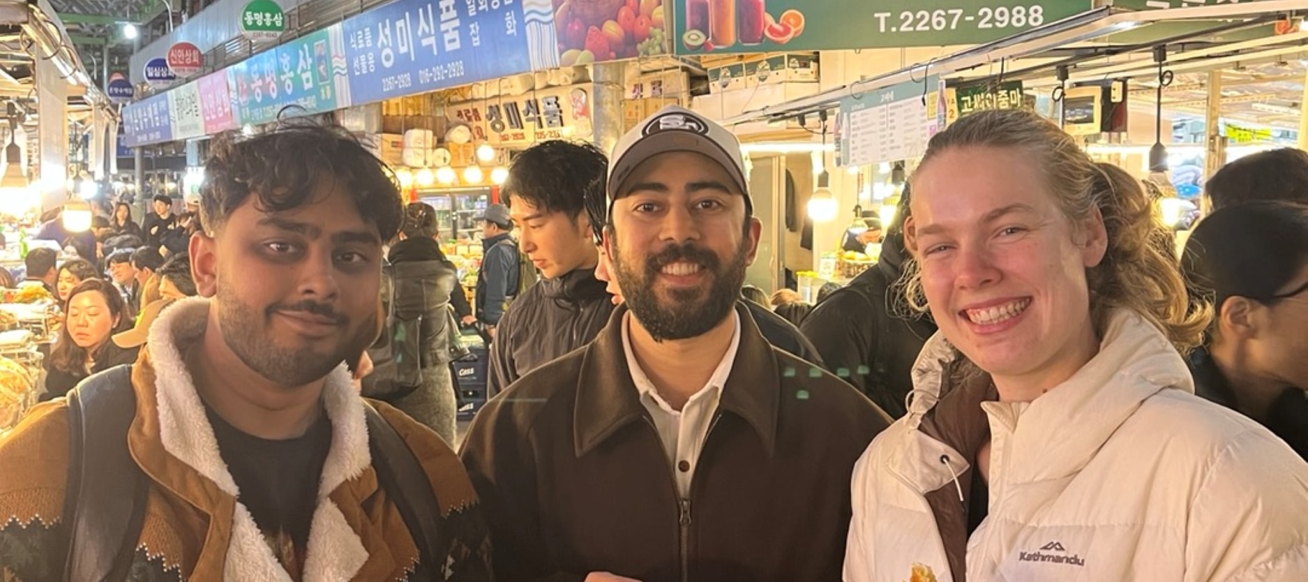 Guests chatting at a busy vegan street stall.