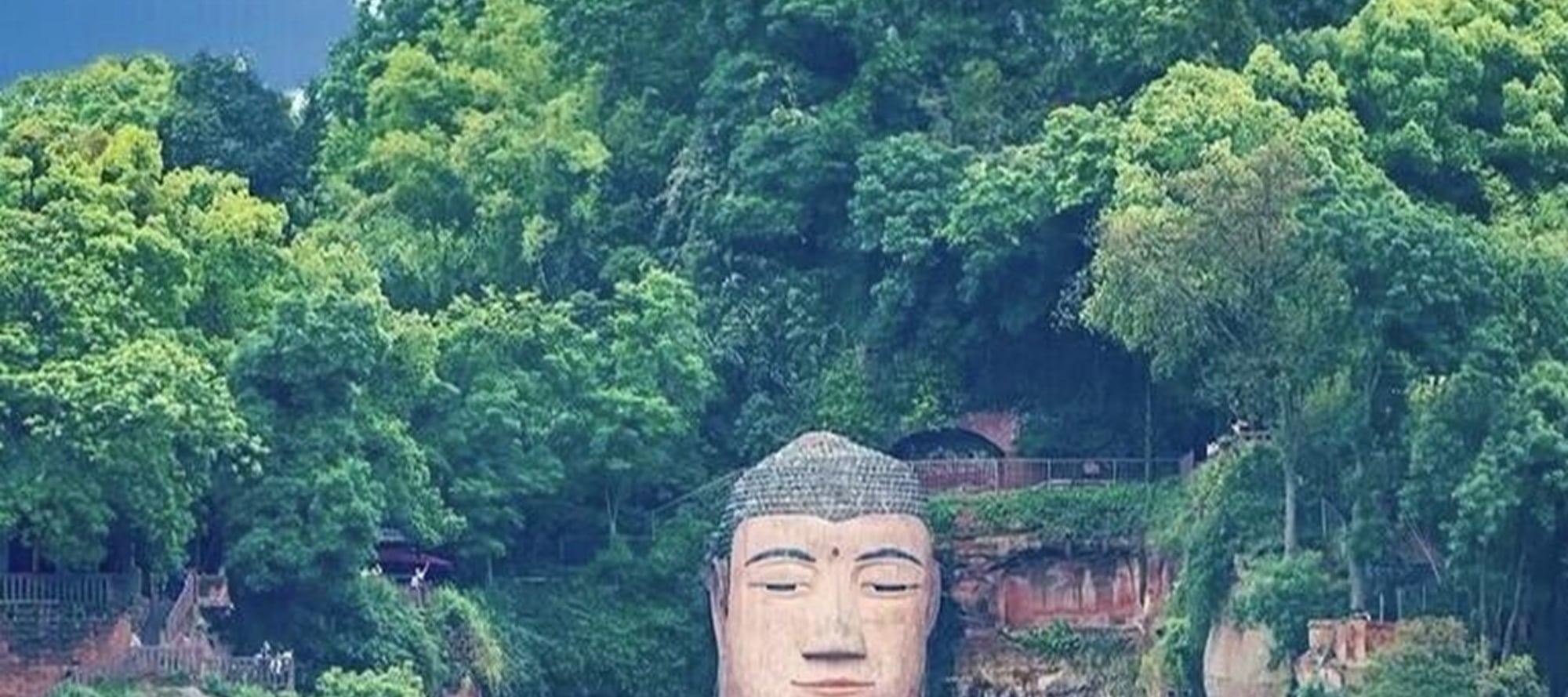 On the top of Leshan Mountain, the Giant Buddha stands tall. Between the green shadows and blue sky, witness the miracles carved by time and start a soul-stirring journey