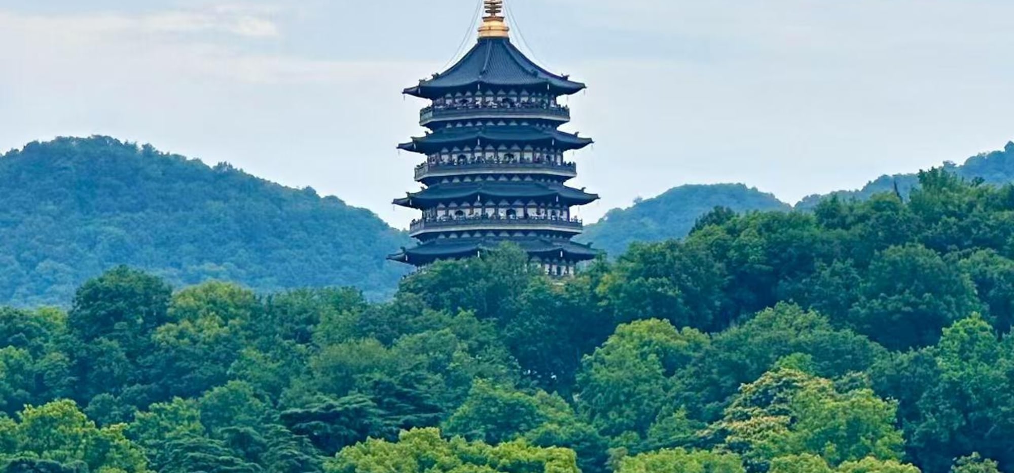 Nestled amidst lush greenery, the Leifeng Pagoda exudes ancient charm, quietly recounting legendary tales of bygone eras.