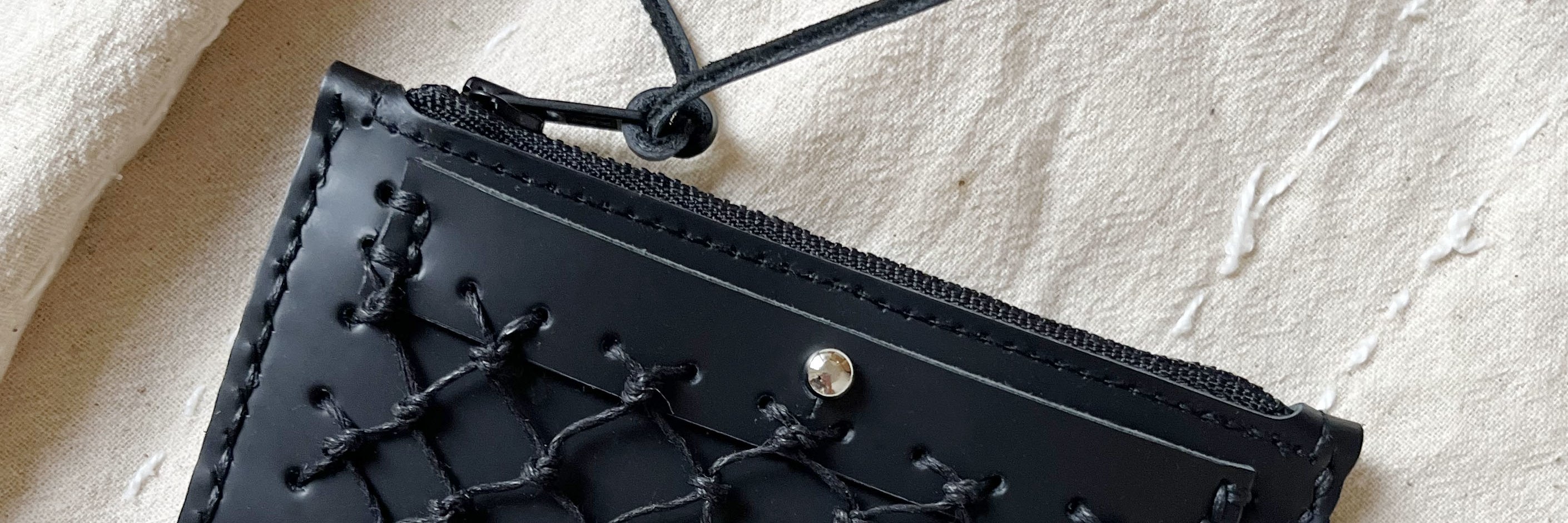 Use leather crafting techniques to easily sew together a loose bag.