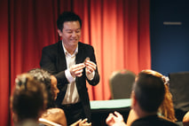 Ming Da, The Charming Conjurer performing magic