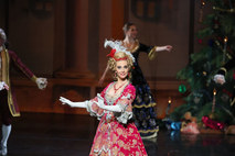 Ballerina in an ornate crimson and gold Baroque go