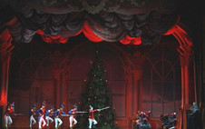 Toy soldiers in blue and red uniforms line up with