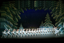 Corps de ballet of snowflakes in white tutus in a
