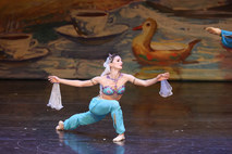 Soloist in a turquoise and jewelled Arabian costum