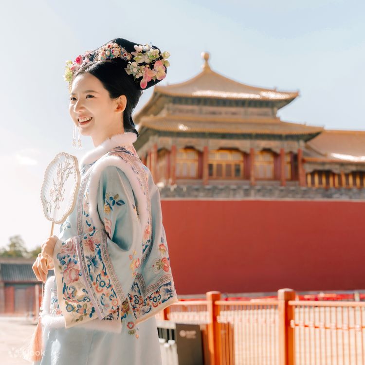 Tourists take photos in ancient Chinese costumes of Qing Palace princesses in Beijing Klook