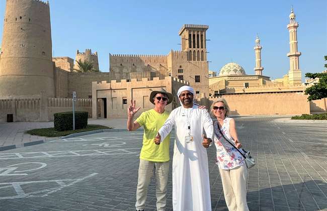 Guests standing outside Ajman Fort during a private guided cultural tour.