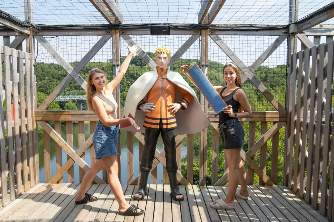 Visitors beside a Naruto display inside Shinobi-Zato