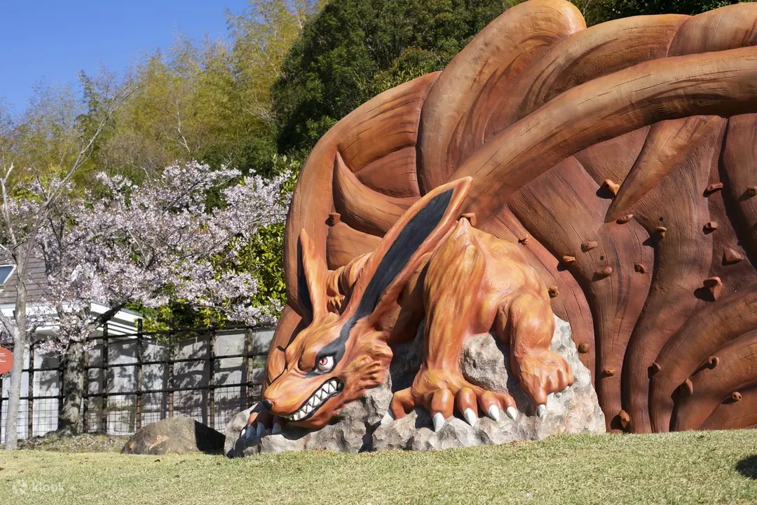 Kurama display surrounded by spring blossoms at Shinobi-Zato