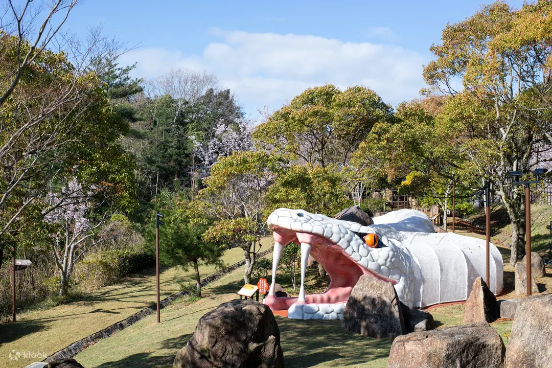 White snake display among greenery at Shinobi-Zato