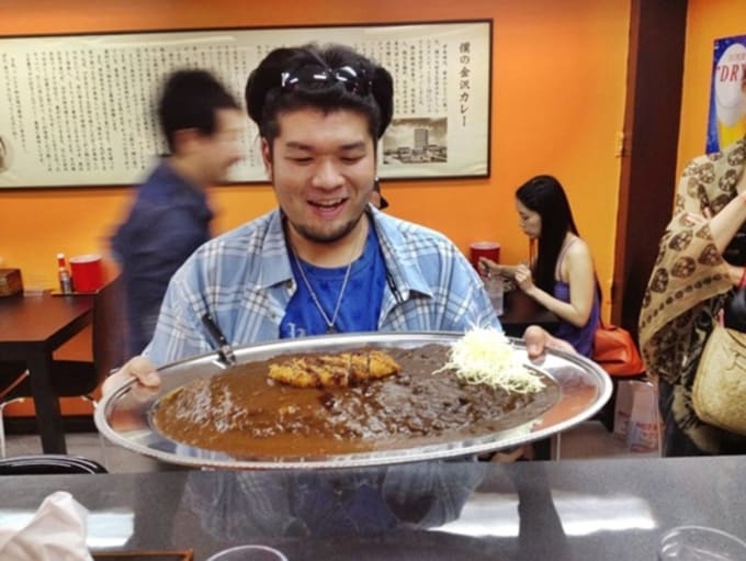 Man with giant japanese curry in Bangkok