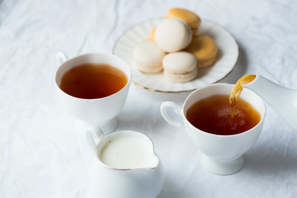 Pouring tea with milk
