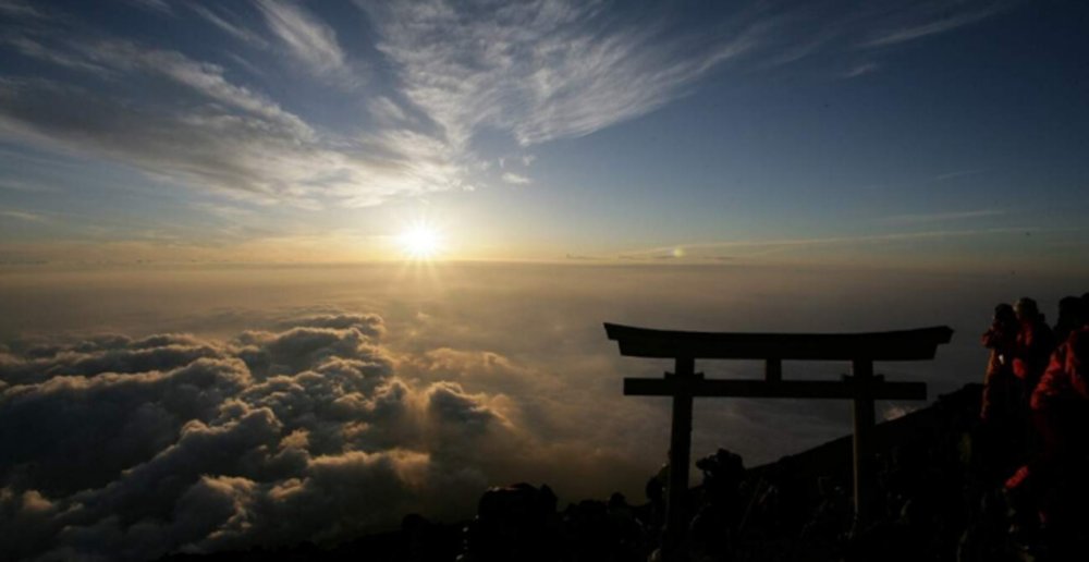 Be welcomed by a sea of clouds atop Mount Fuji.
