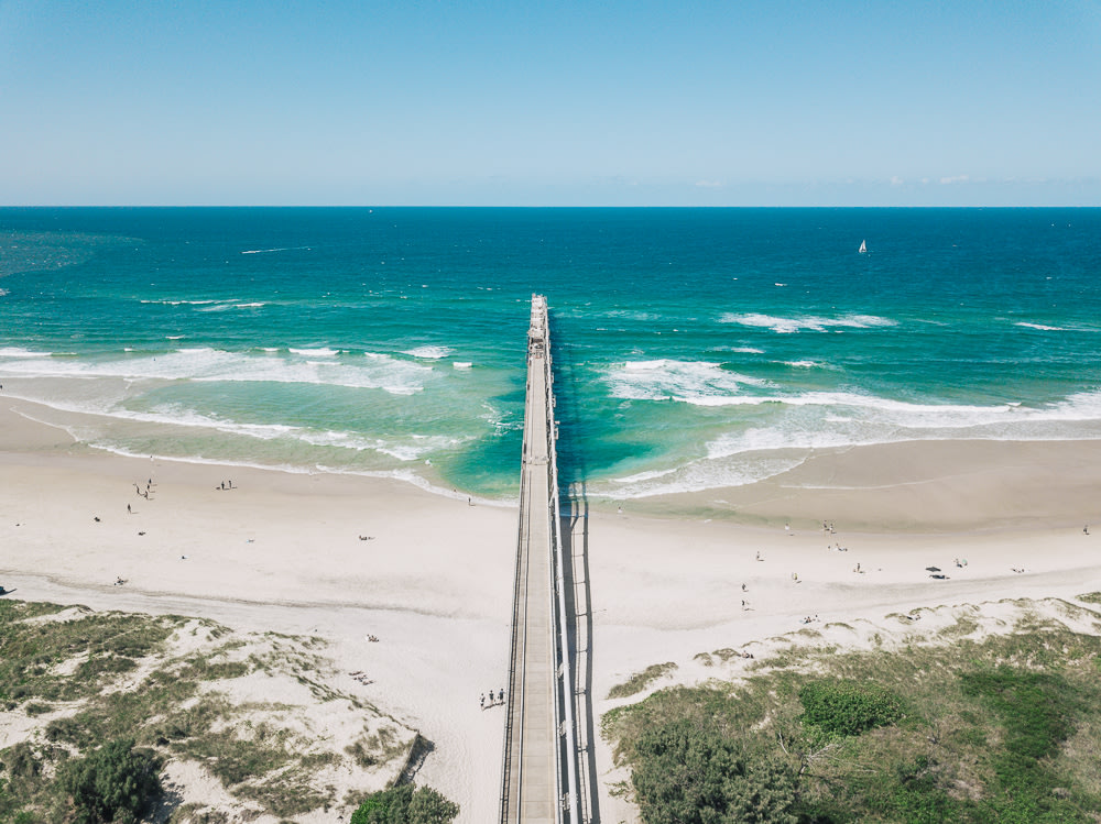 A photo of the bridge extending to the beach of The Spit.