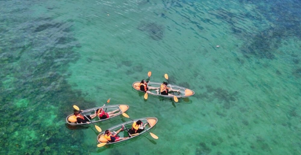 See the world down under while drifting along on a clear kayak