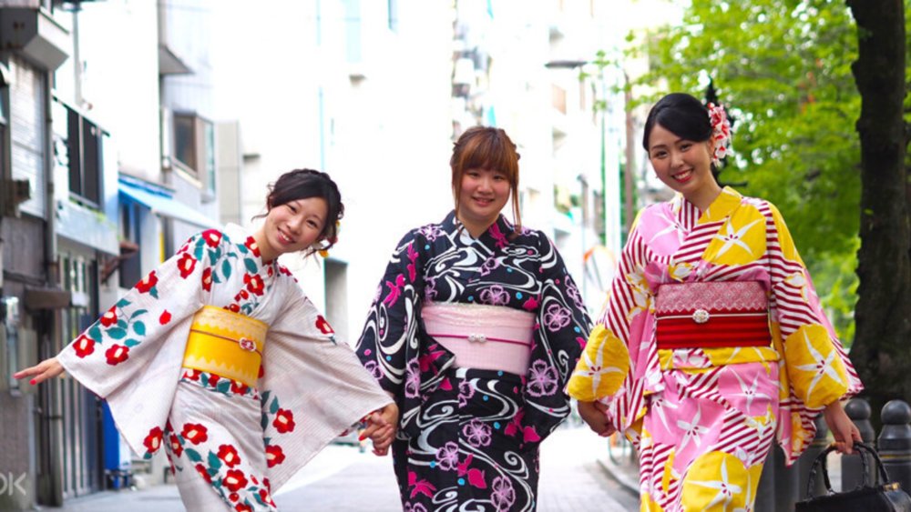 Three ladies wearing the colorful and beautiful Japanese Kimono