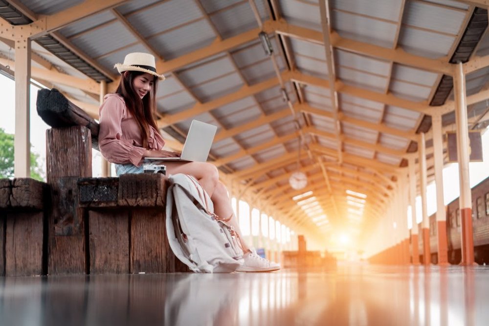 Traveler Open Laptop on Train Station