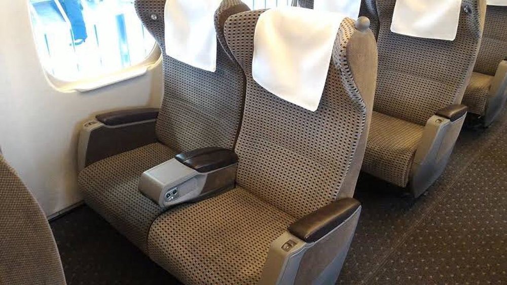 green car seats in the jr train