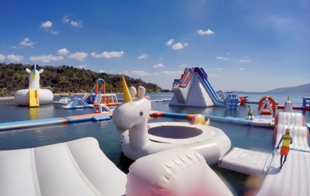 inflatable unicorn float rainbow colourful sea beach playground 