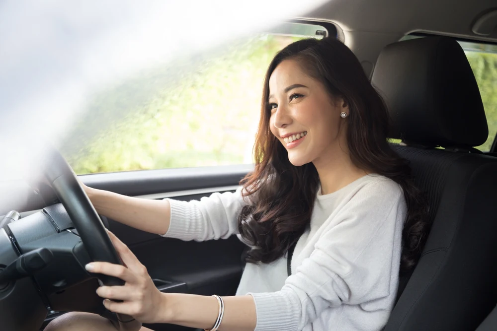 Asian Woman Driving in the Right Side