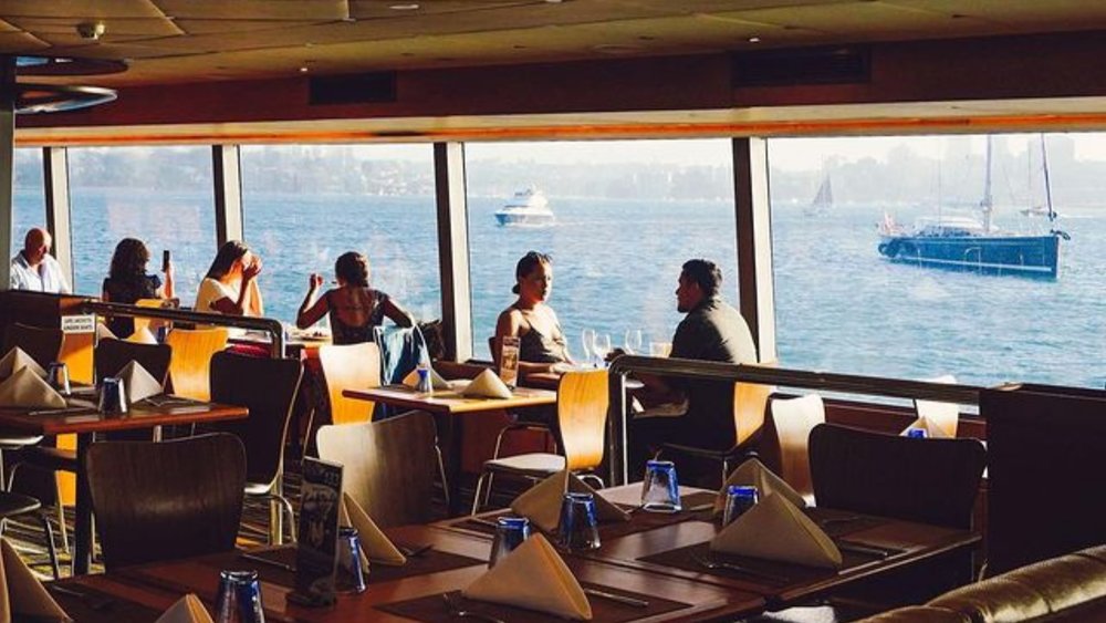 Unwind with your favourite drink on the Sydney Harbour Bar Cruise. Credits: @captaincookcruises