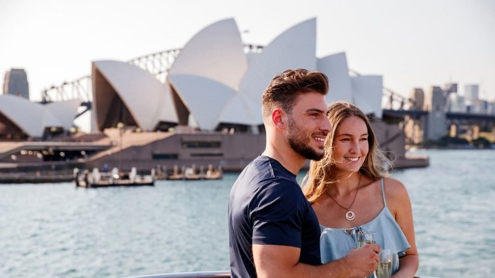 Wine and dine as you cruise by Sydney Harbour for a romantic getaway. Image credits: @captaincookcruises on Instagram