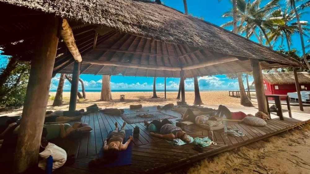 Do yoga by the beach and relax your mind. Image credits: @trinity_beach_yoga