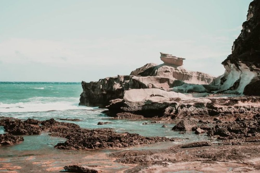kapurpurawan rock formation near the beach