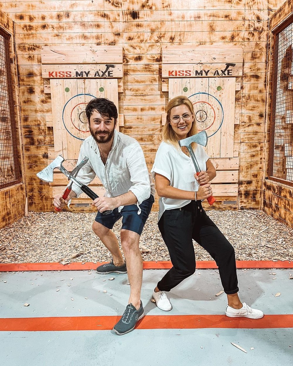 A couple that goes axe throwing together stays together. Image credits: @kissmyaxe.au on Instagram