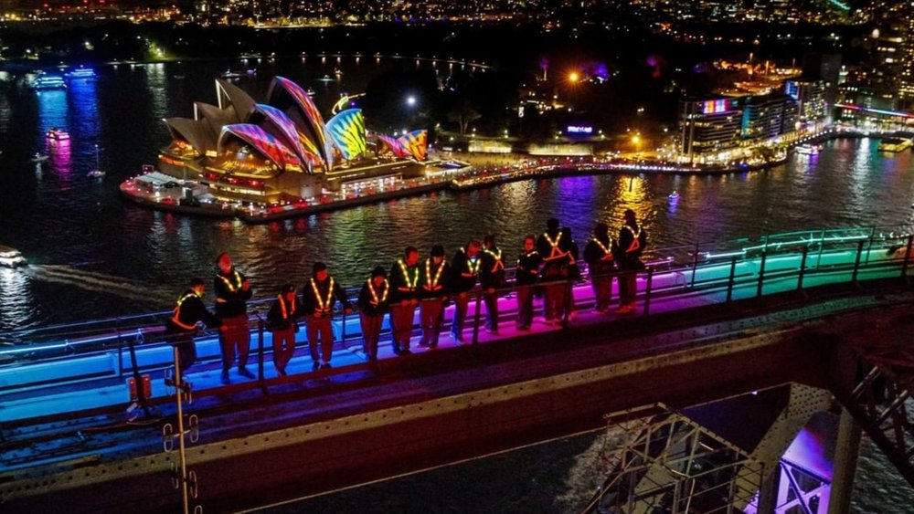 Climb the Sydney Harbour Bridge and get a great view of the festival!. Image credits @vividsydney on Instagram