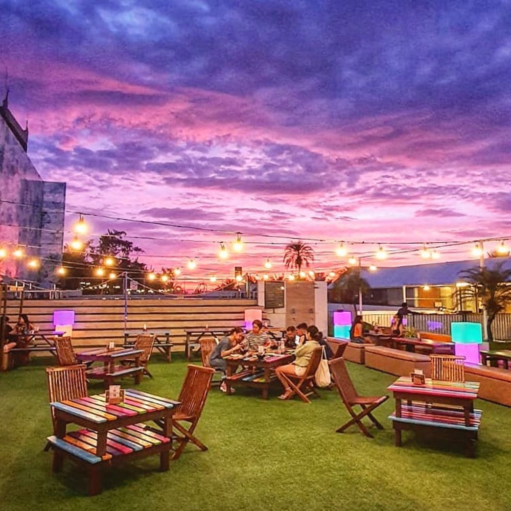 dining area on the rooftop of Tides Hotel
