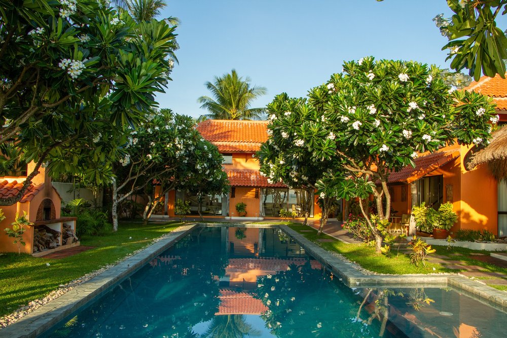 Cebu Beach House Villa and its pool surrounded by trees