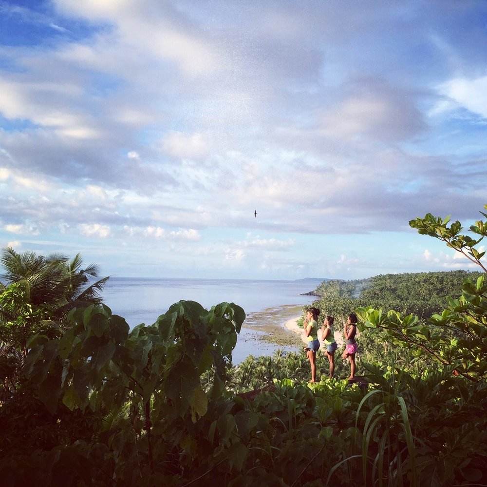 three girls meditating in the Bacalla Woods Campsite