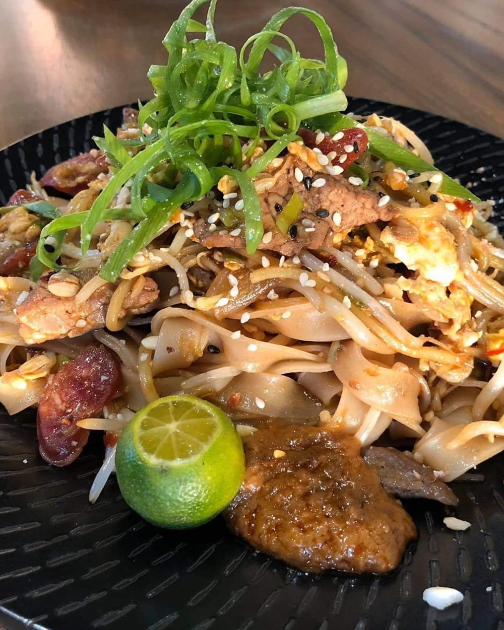 noodles and beef on a plate