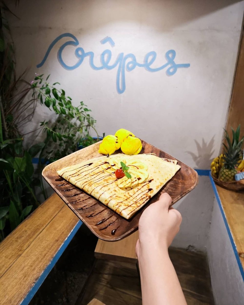 a crepe on a wooden plate