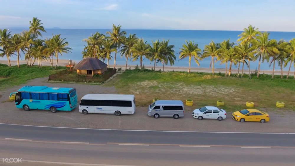 five cars on the road by the beach in boracay island