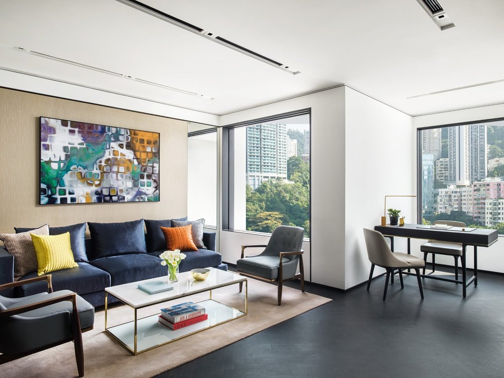 living space with large windows and study desk at murray hong kong