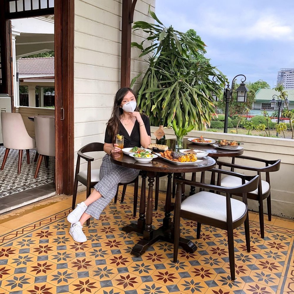 Girl dining in an aesthetic restaurant in Cebu