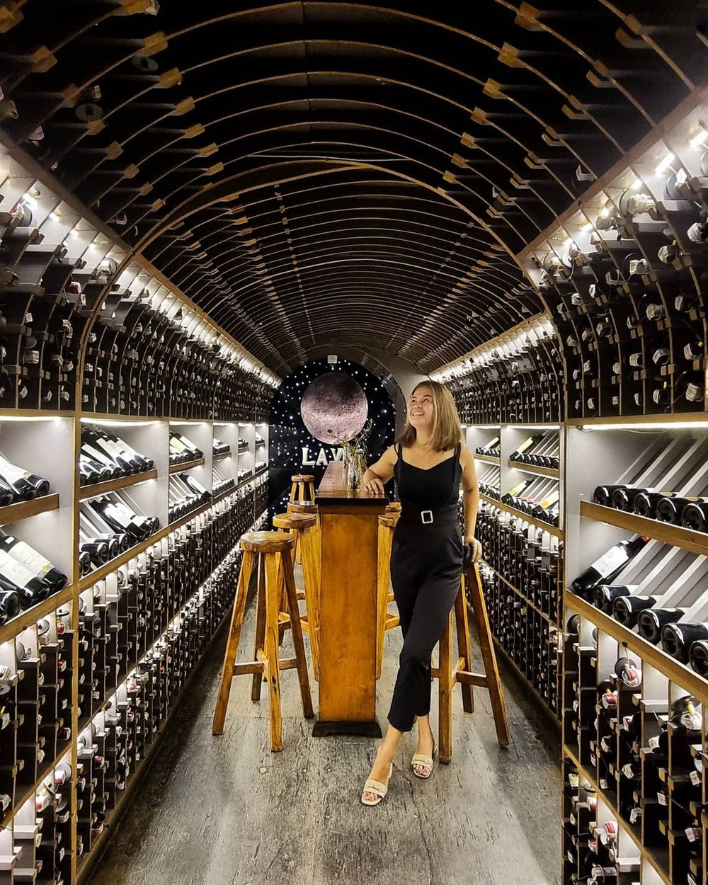 Lady in the middle of wine rack