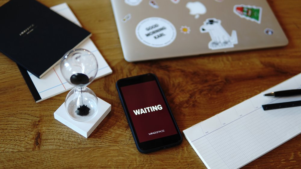 laptop and a few pieces of papers