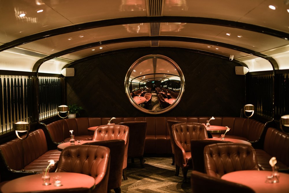 red leather couches in hong kong bar foxglove