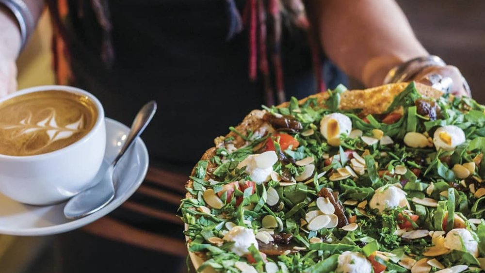 Re-energize with some comfort food and a cup of joe at Kuranda’s many restaurants. Image credits: @kurandavillage on Instagram