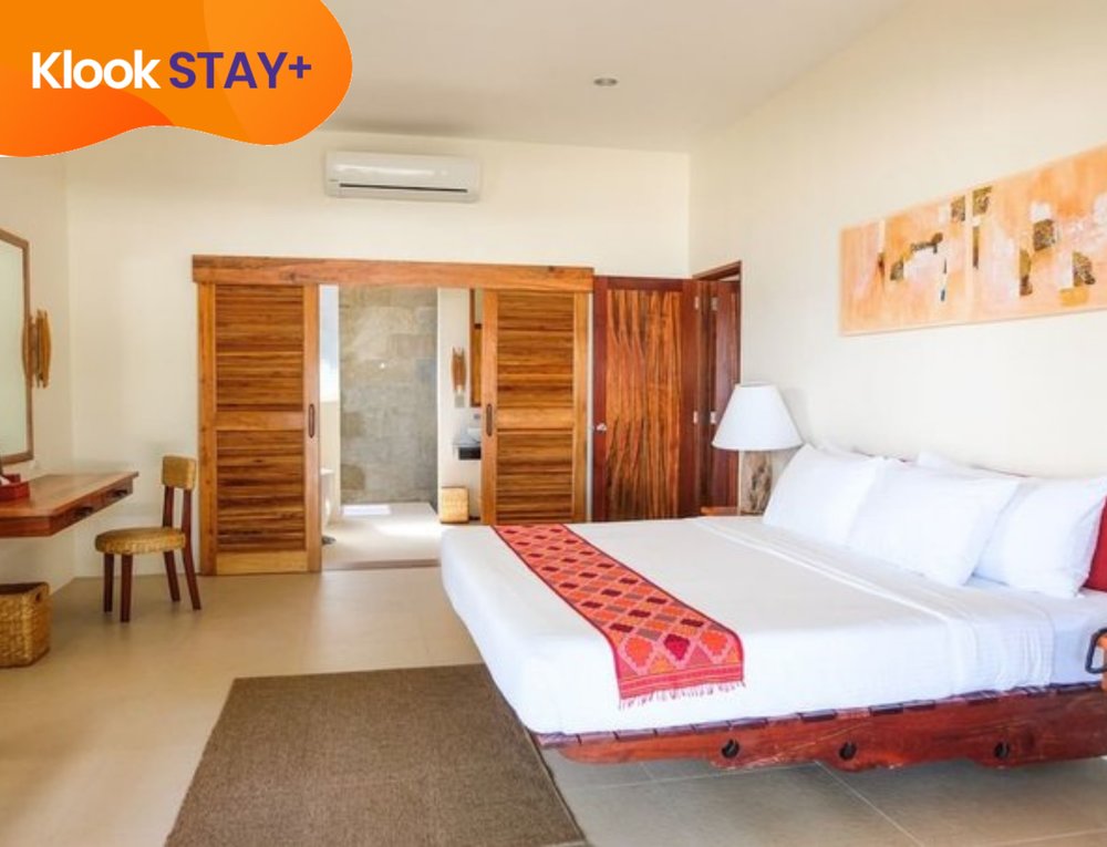 guestroom with bed at bluewater maribago