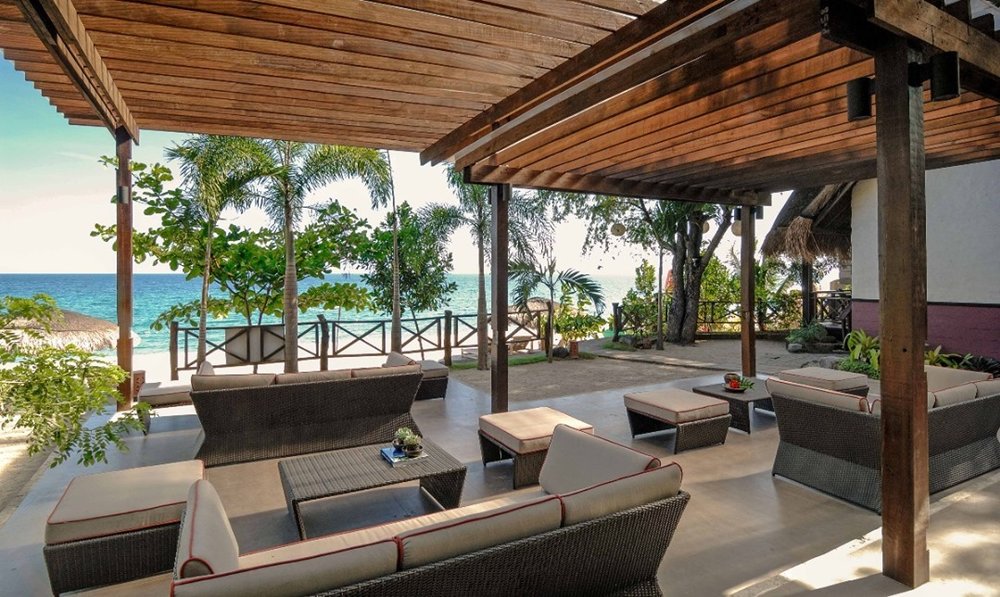 lounge area overlooking beach at sabangan beach resort