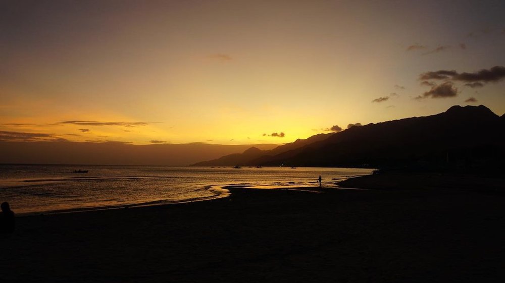 sunset silhouette at laiya riviera batangas beach resort