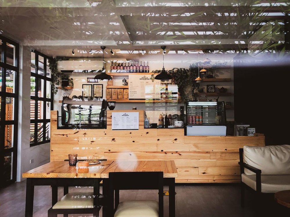 coffee bar and dining area at pots and kettles cafe in laguna