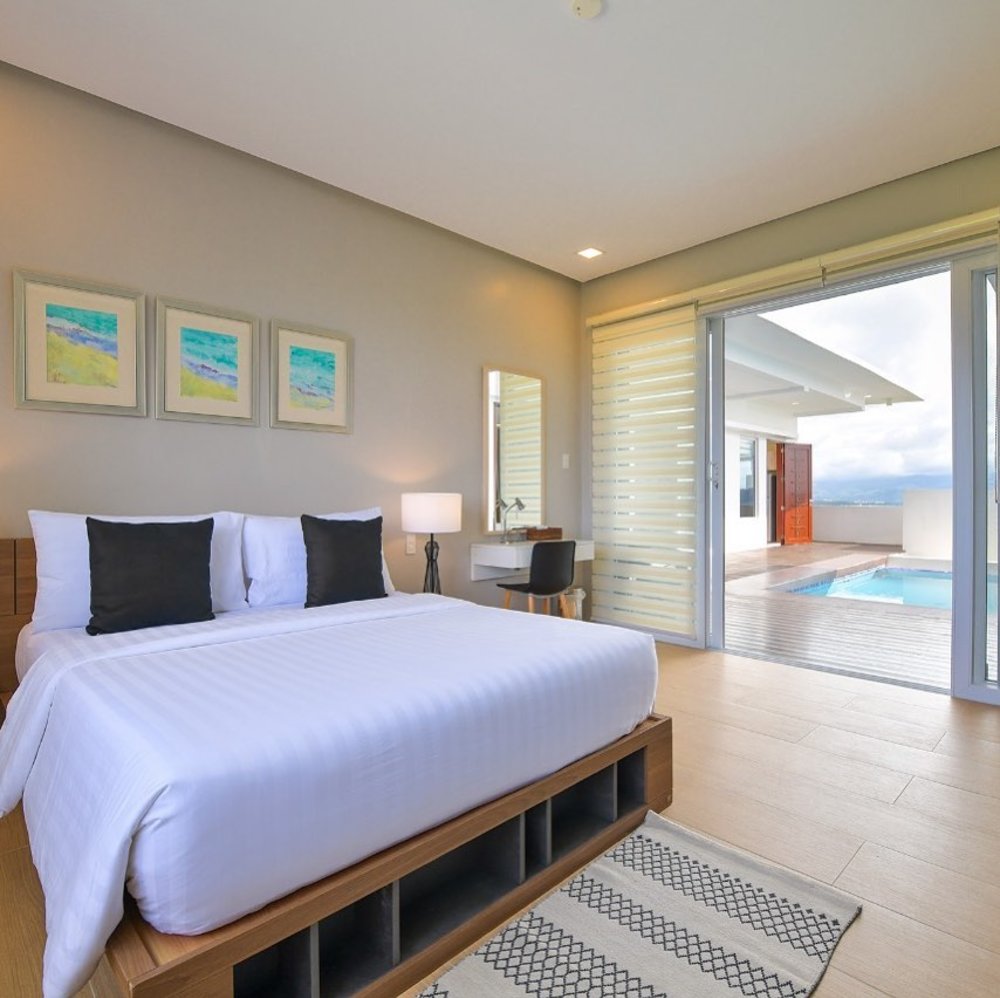 bedroom by pool at one hagdan boracay beach villa