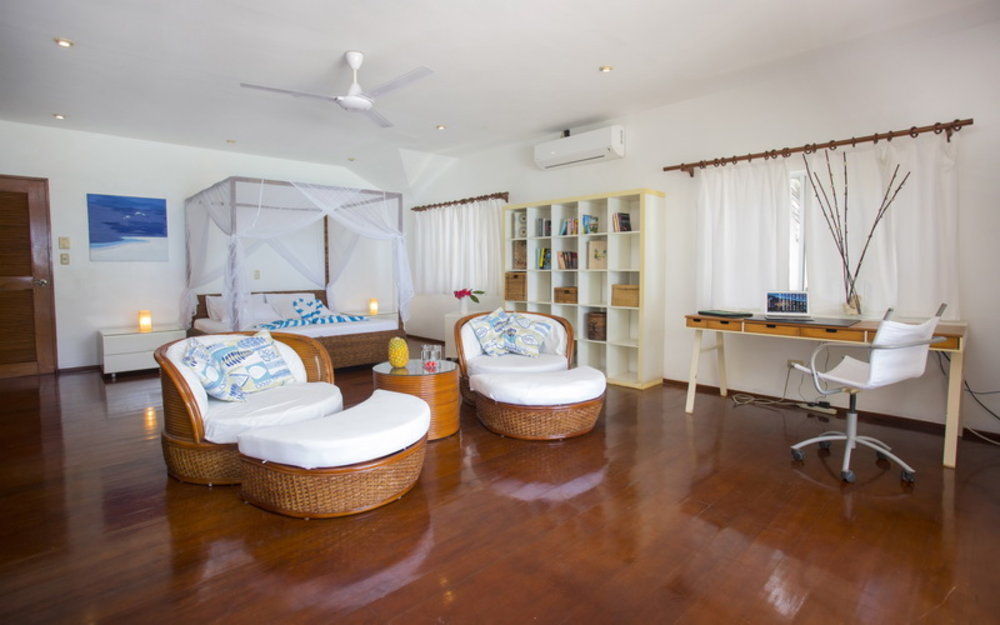 spacious bedroom white furniture at mauhay beach house boracay villa