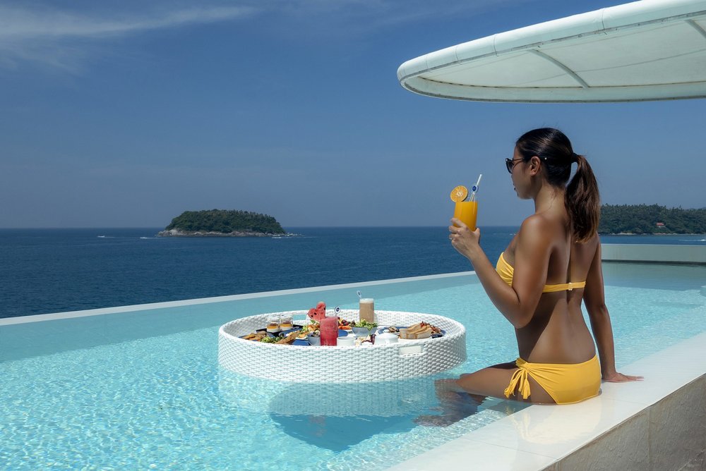 woman in a bikini in kata rocks