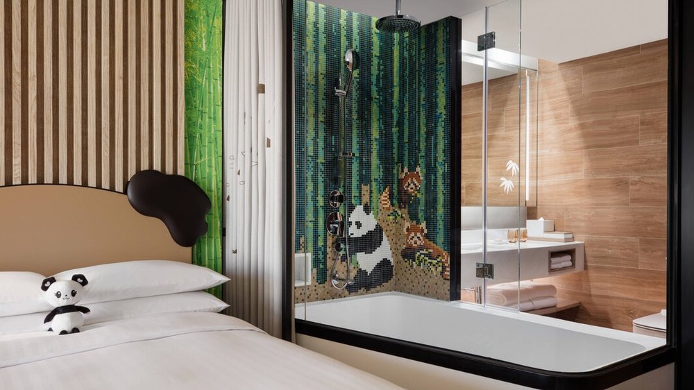 stuff toy on bed beside bathroom at ocean park marriott hotel